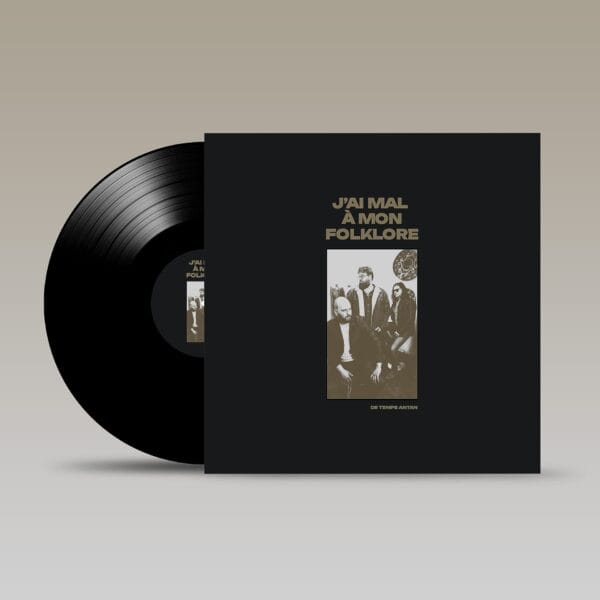 A vinyl record next to its black album cover, which features a photograph of four people and the text "J'AI MAL À MON FOLKLORE" and "DE TEMPS ANTAN" in gold.